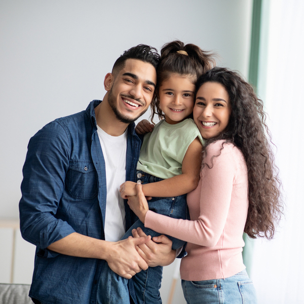 Family of 3 Smiling Indoors