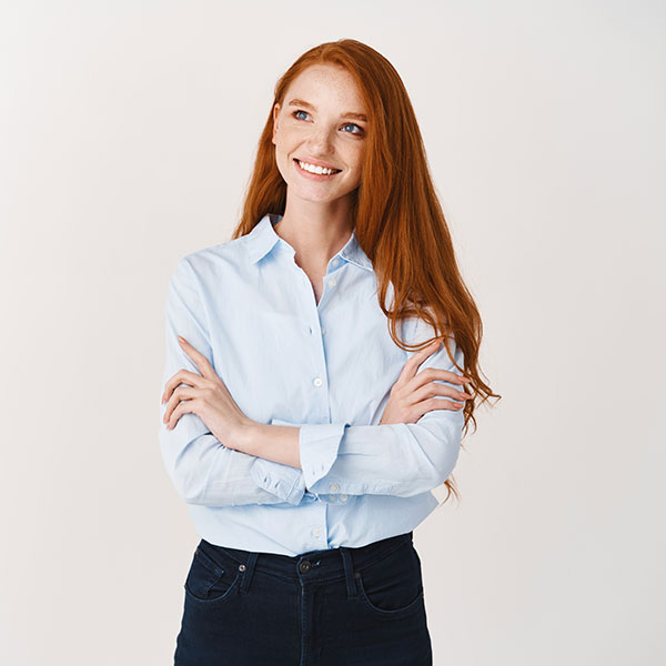 Woman with Red Hair Smiling Indoors